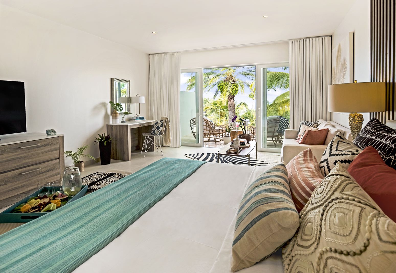 Hodges Bay Resort junior suite, double bed, bright modern decor, private balcony