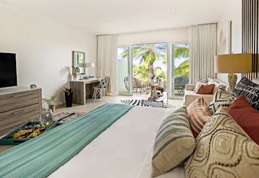 Hodges Bay Resort junior suite, double bed, bright modern decor, private balcony