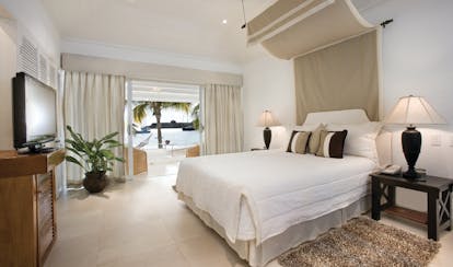 Inn at English Harbour Antigua beach cabana bedroom opening up to beach views
