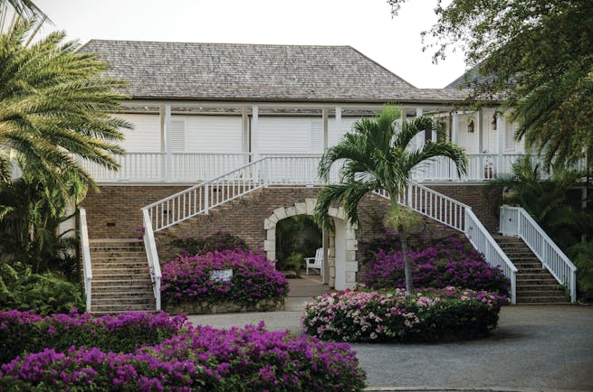 Inn at English Harbour Antigua hotel exterior purple flowers palm trees