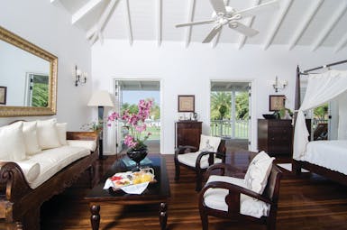 Inn at English Harbour Antigua deluxe junior suite lounge area terrace with garden views