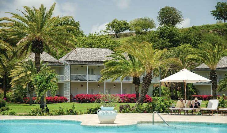 Inn at English Harbour Antigua pool sun loungers palm trees
