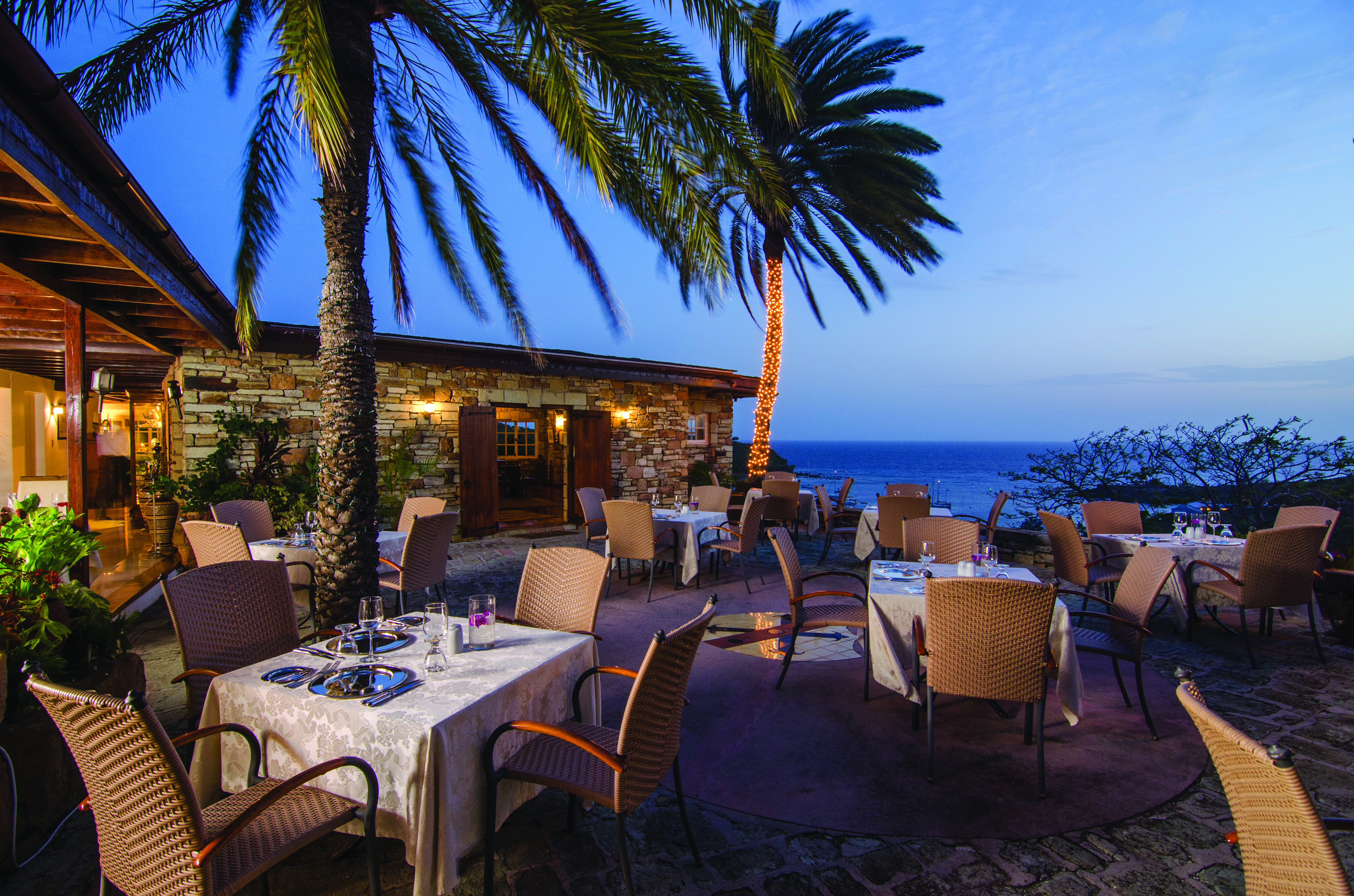 Inn at English Harbour Antigua restaurant outdoor dining by night overlooking the ocean