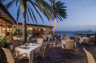 Inn at English Harbour Antigua restaurant outdoor dining by night overlooking the ocean
