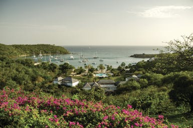 Inn at English Harbour Antigua scenery hotel complex overlooking sea boats on the water