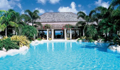 Jumby Bay Antigua hawks bill cove pool private pool palm trees