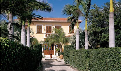 Jumby Bay Antigua la casa private residence entrance pathway palm trees