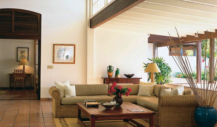 Jumby Bay Antigua lounge indoor seating area sofas modern décor