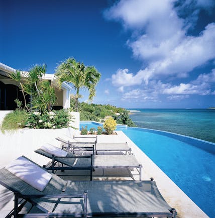Jumby Bay Antigua villa pool private infinity pool overlooking sea