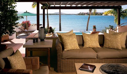 Jumby Bay Antigua villa terrace sofa pool overlooking sea