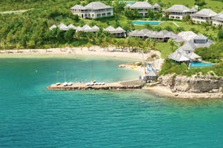 Nonsuch Bay Antigua aerial view of resort beach and jetty