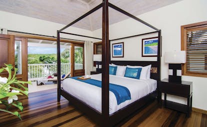 Nonsuch Bay Antigua deluxe suite bedroom leading to balcony