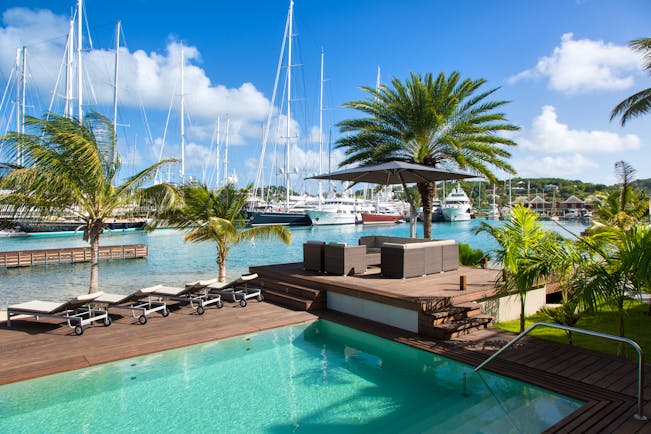 South Point pool deck, swimming pool, sun loungers, deck overlooking harbour
