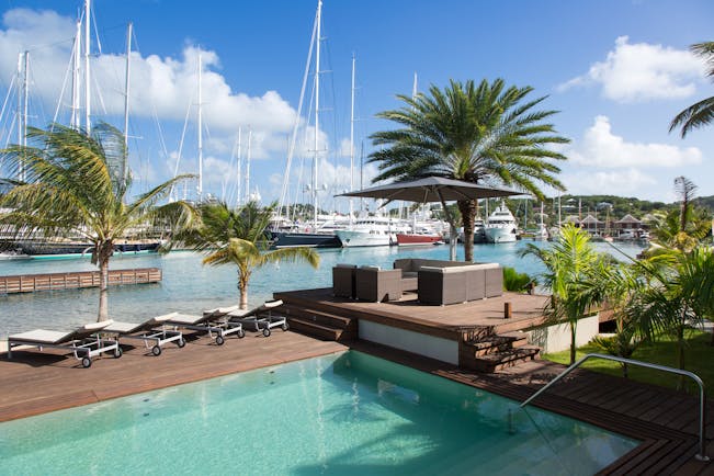 South Point pool deck, swimming pool, sun loungers, deck overlooking harbour