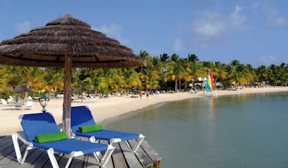 St James's Club Antigua beach terrace sun loungers umbrella