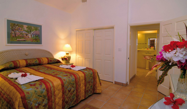 St James's Club Antigua bedroom bed flower arrangement modern décor