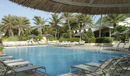 St James's Club Antigua main pool sun loungers beach in background