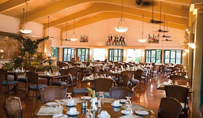 St James's Club Antigua rainbow restaurant interior dining tables modern décor