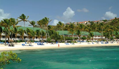 St James's Club Antigua sandy beach white sand sun loungers palm trees