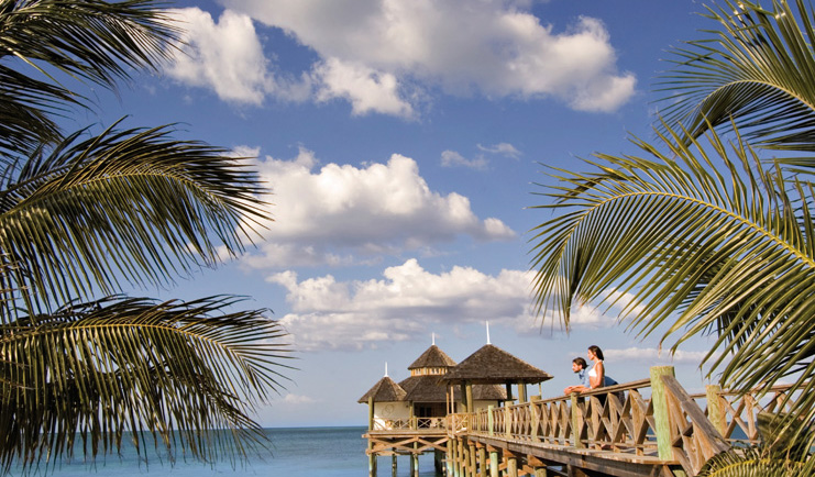 Kamalame Cay Bahamas ocean palm trees bridge to pagoda in the sea