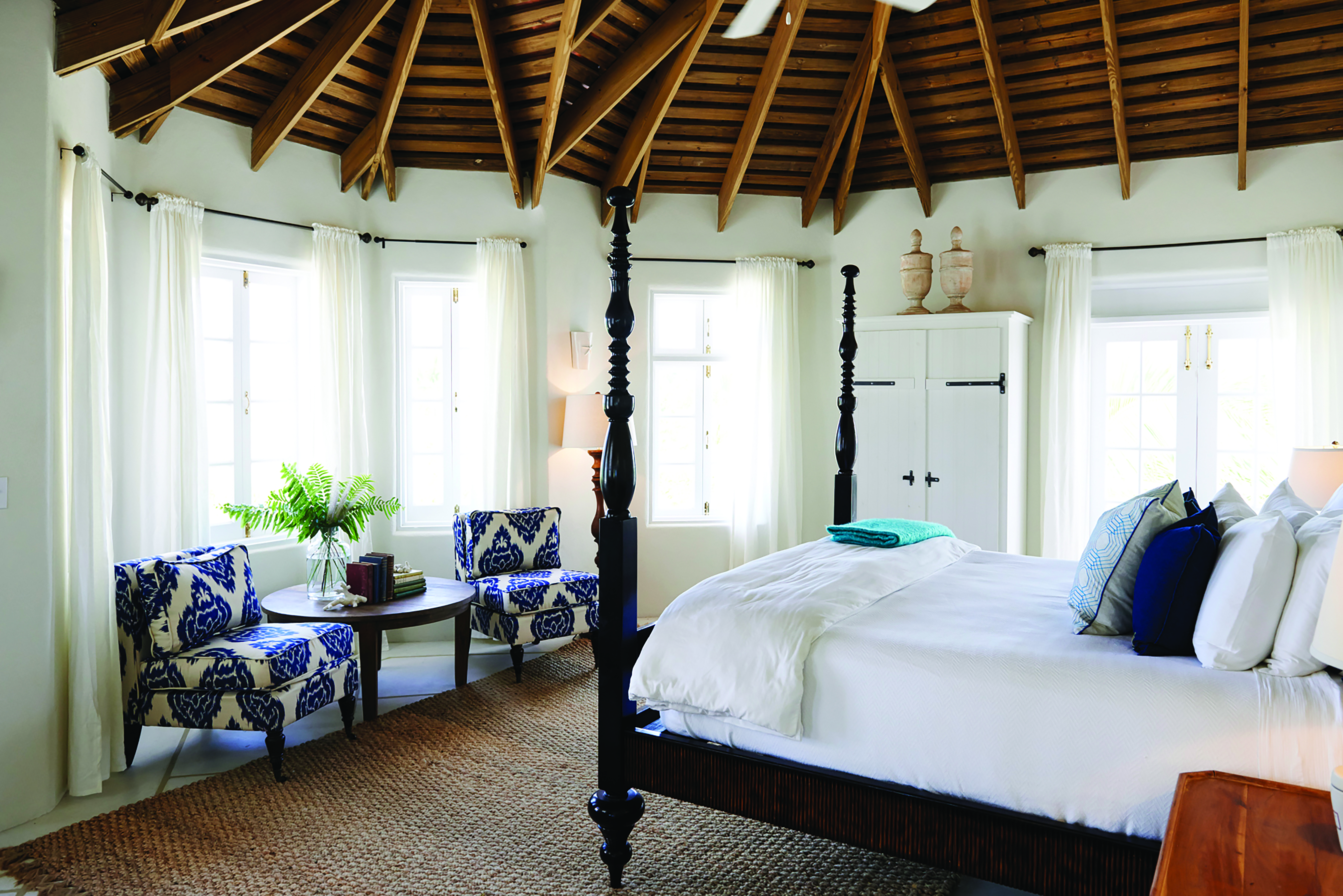 Kamalame Cay Bahamas villa bedroom  with armchairs and wardrobes 