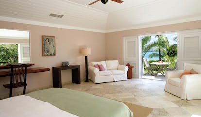 Pink Sands Bahamas ocean view cottage bedroom sofa armchair ocean view and garden terrace