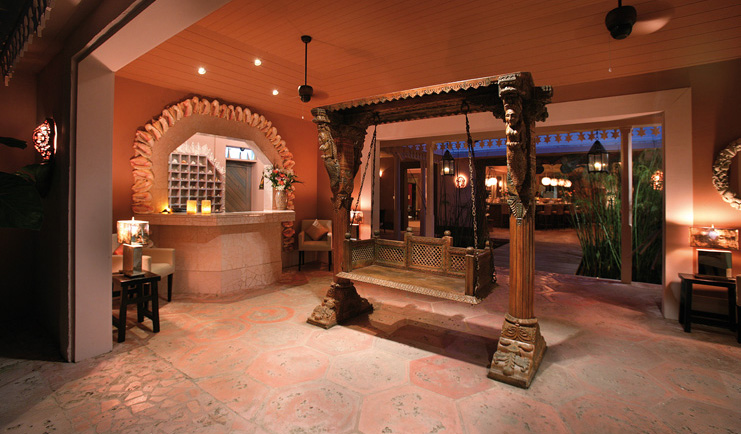 Pink Sands Bahamas reception desk traditional Asian sculptures