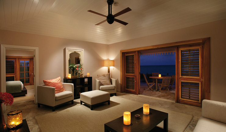 Pink Sands Bahamas suite lounge large room with sofas armchairs and deck access