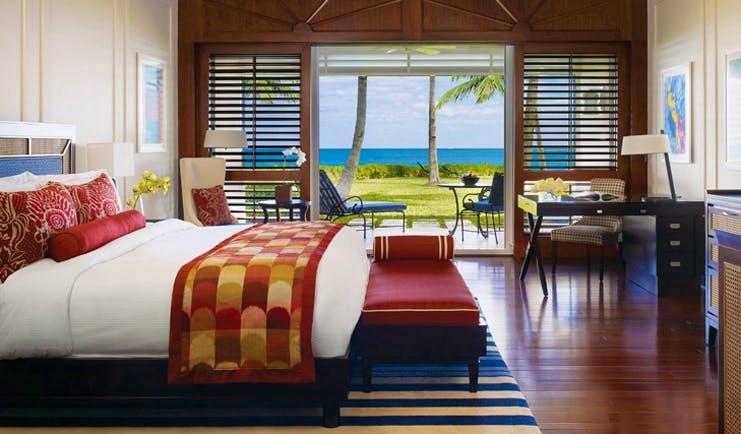 Four Seasons Ocean Club Bahamas beach front bedroom ottoman armchair writing desk patio with seating area