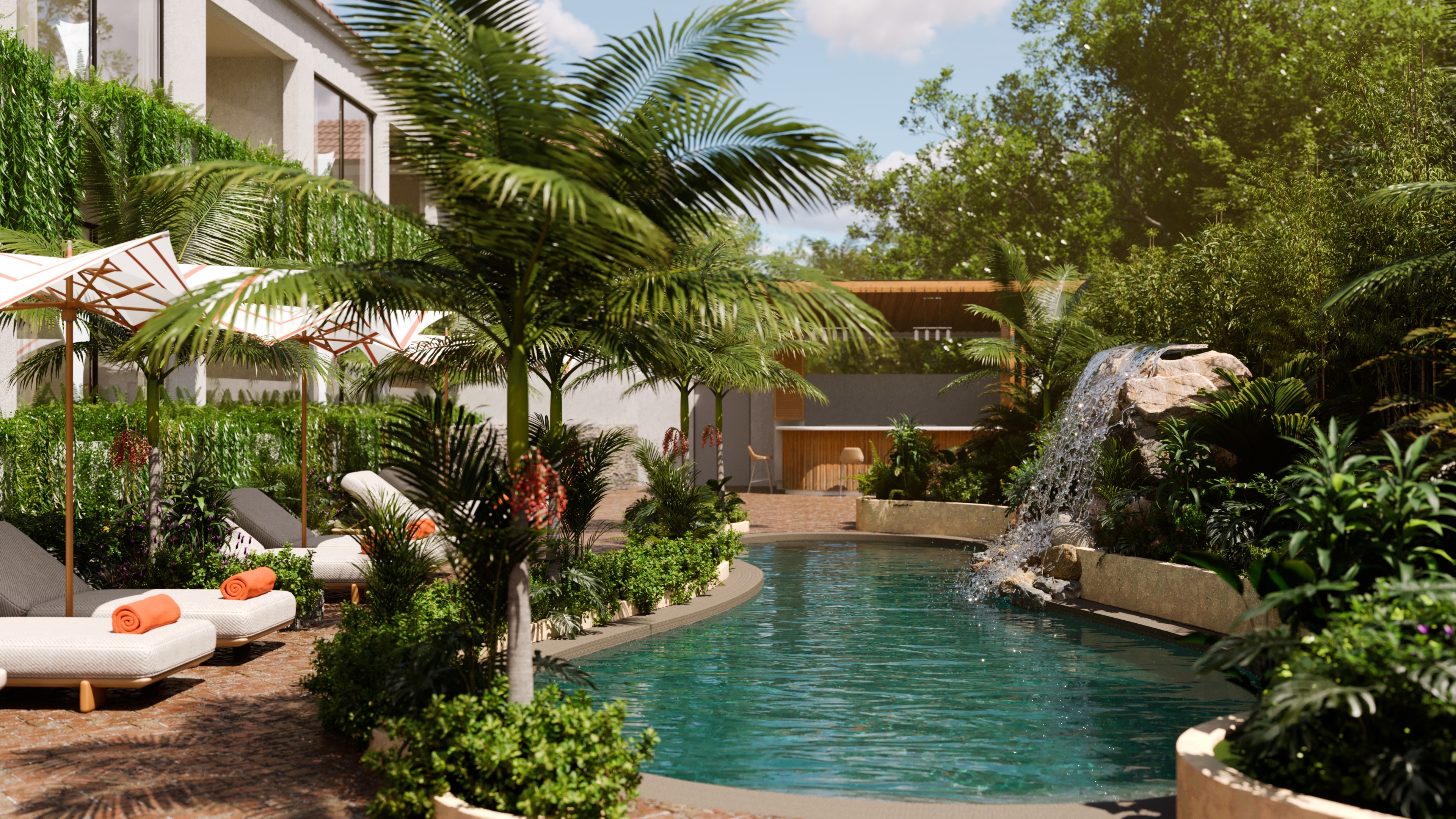 Blue Monkey Hotel poolside, with freeform pool, palm trees, waterfalls, sun loungers, parasols, and the balconies of the hotel suites on the left
