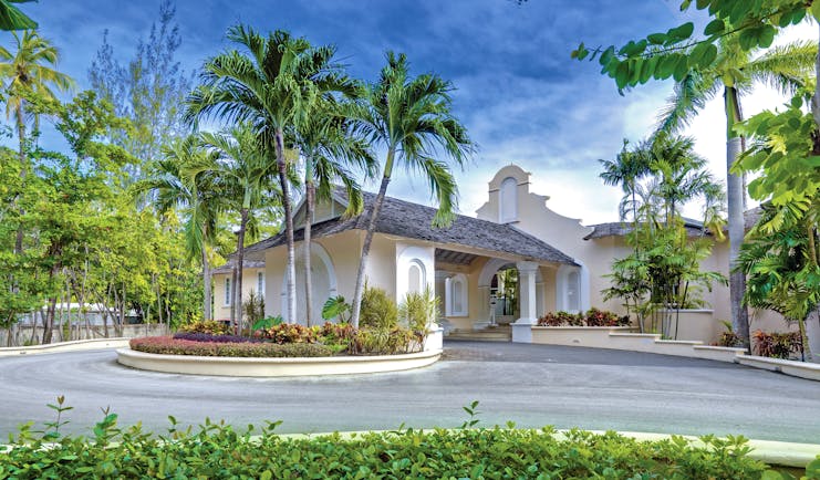 Colony Club Barbados entrance main building with driveway trees and shrubbery 