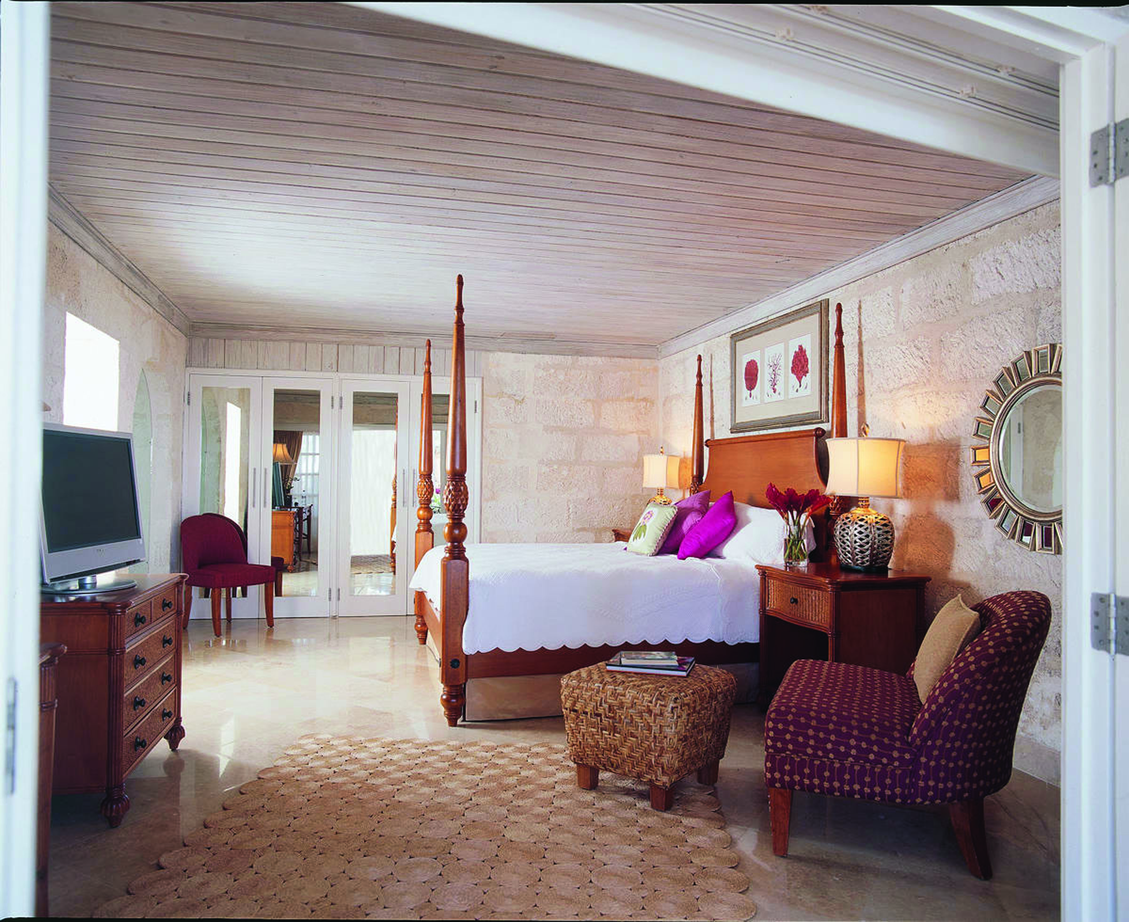 Colony Club Barbados bedroom suite bed with living area and television