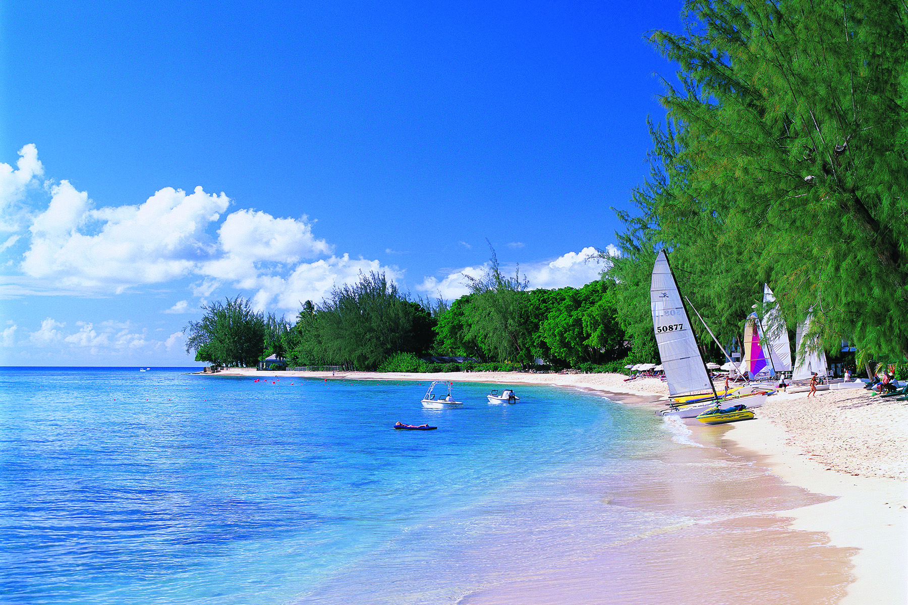 Coral Reef Club Barbados beach and boats on the sand small boats on the water