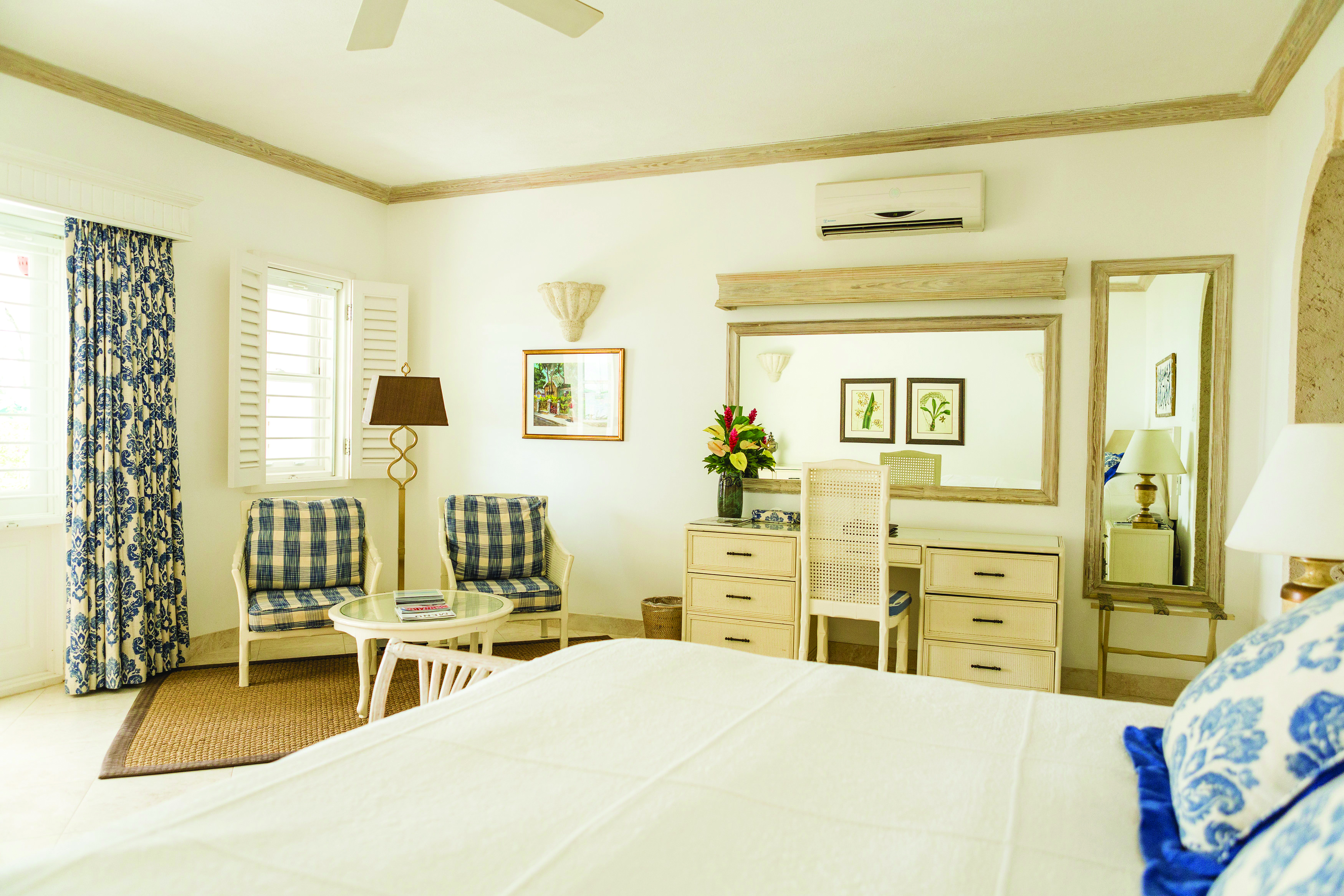 Coral Reef Club Barbados bedroom with living area and dressing table