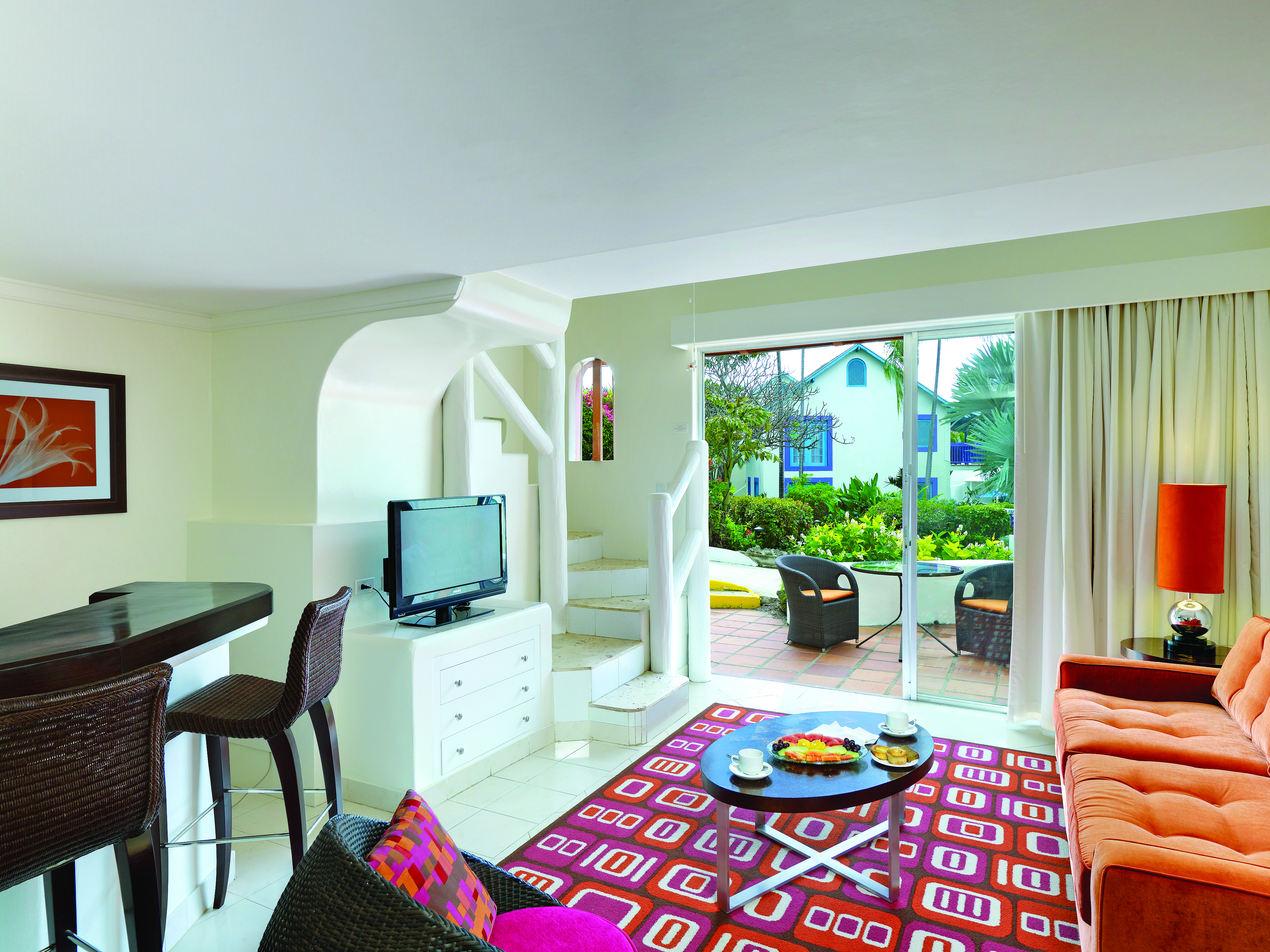 Crystal Cove Barbados downstairs lounge area with private outside seating area through doors