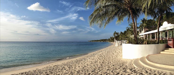 Fairmont Royal Pavilion Barbados beach entrance palm trees sandy beach