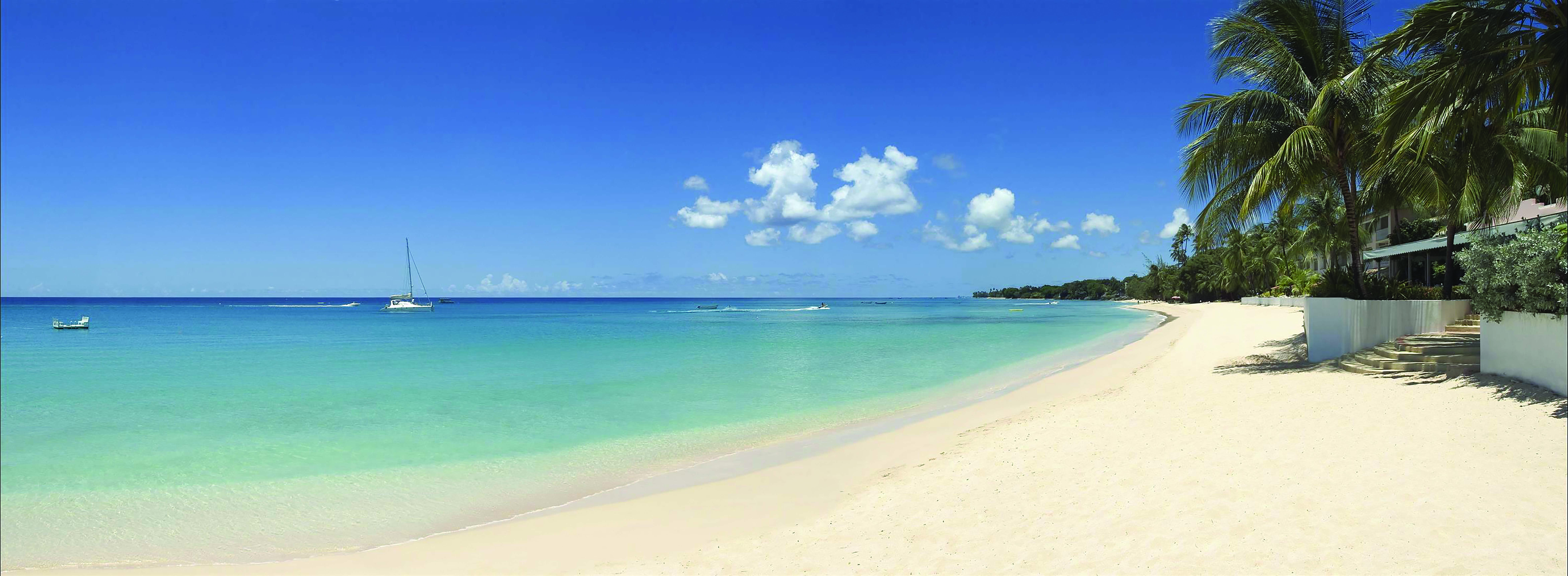 Fairmont Royal Pavilion Barbados sandy beach blue skies and palm trees