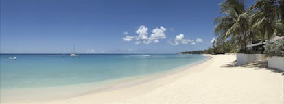 Fairmont Royal Pavilion Barbados sandy beach blue skies and palm trees