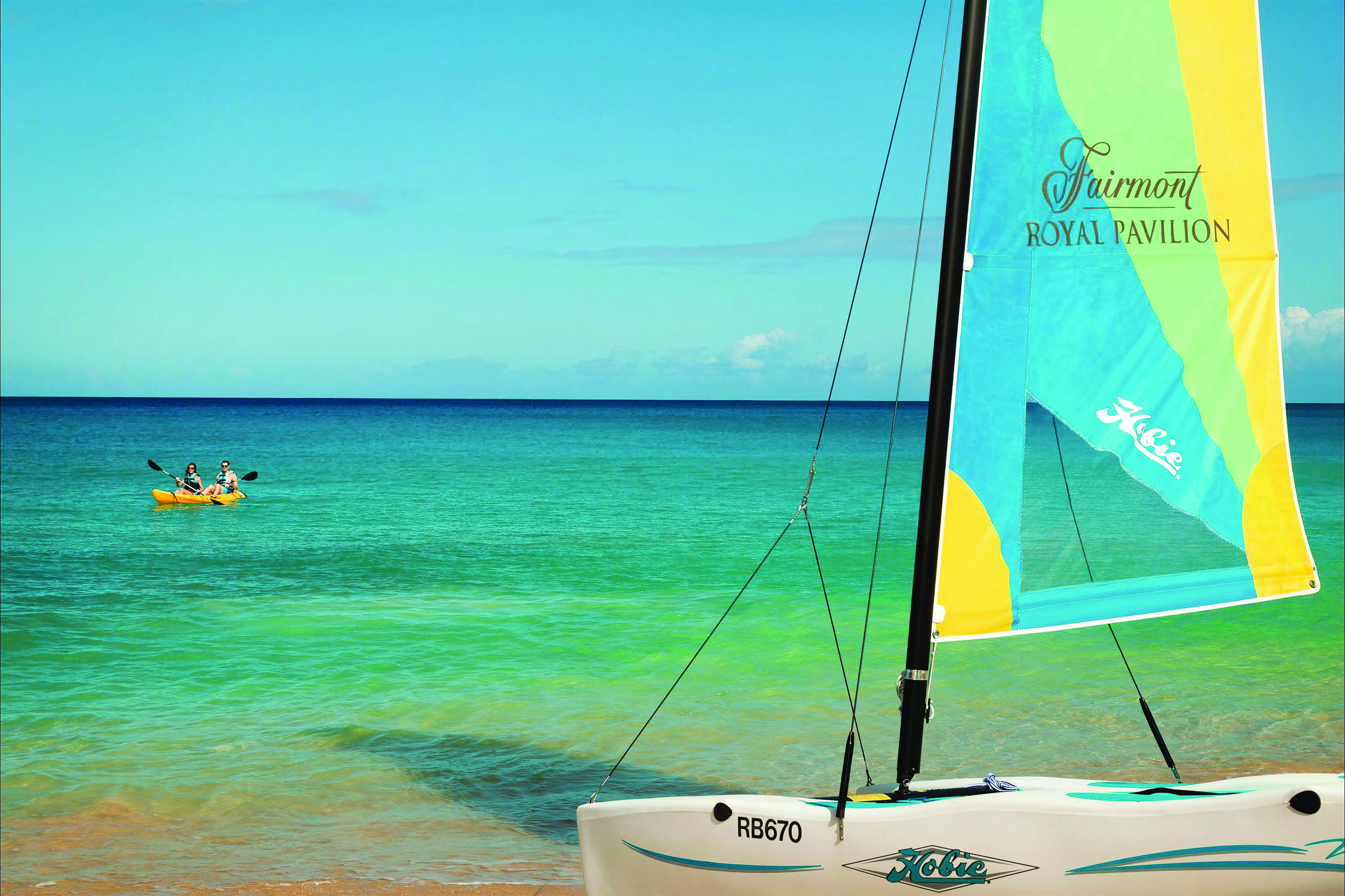 Fairmont Royal Pavilion Barbados water sports hobiecat couple kayaking on the ocean