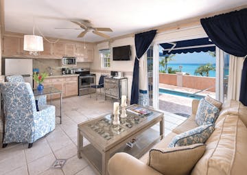 Little Arches Barbados living area with kitchen and seating area leading to outdoor terrace