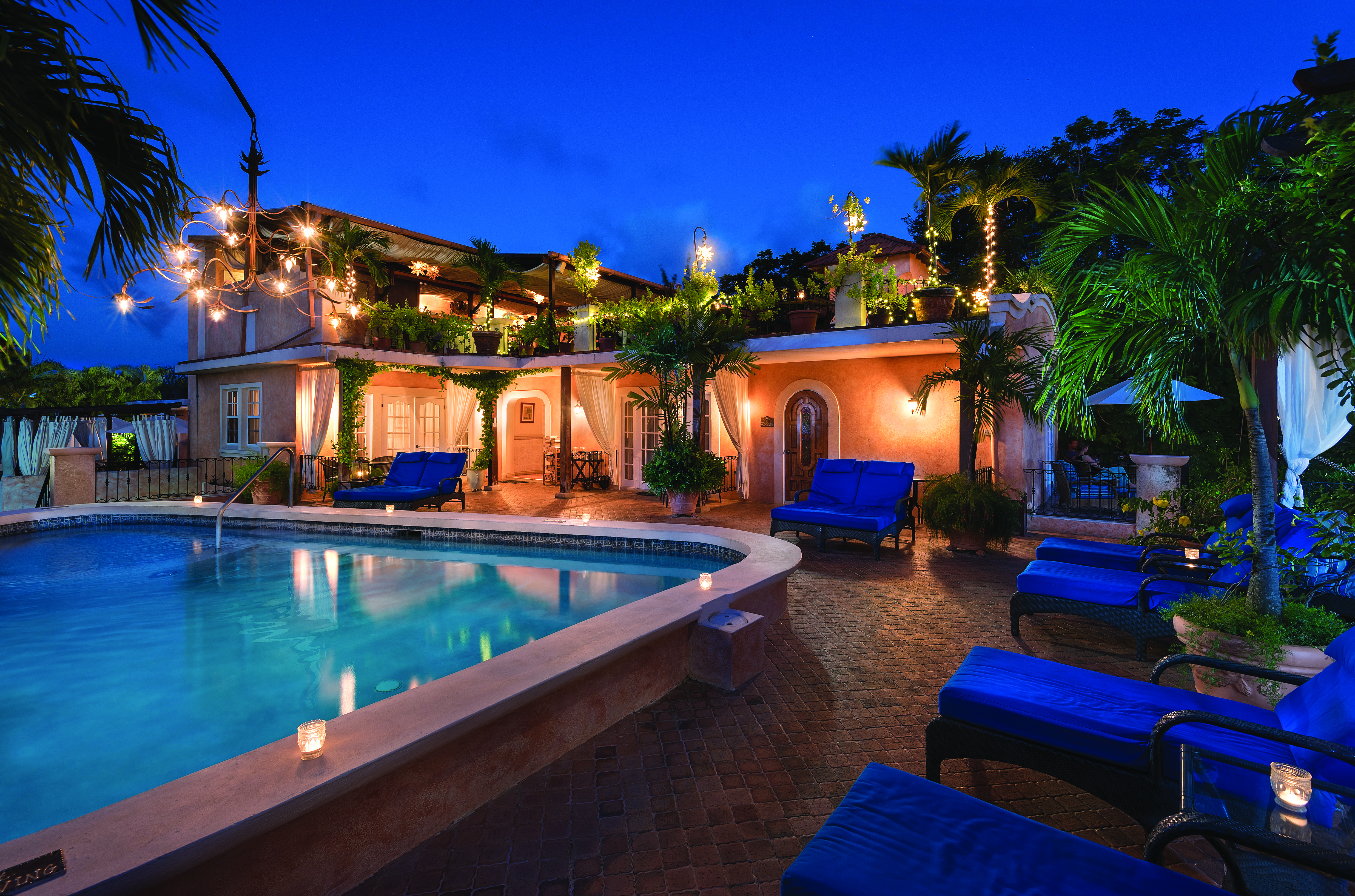 Little Arches Barbados pool at night sun loungers