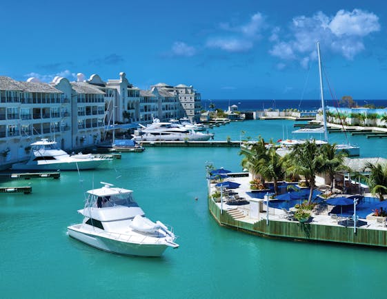 Port Ferdinand Barbados island marina building exterior and boats in harbour