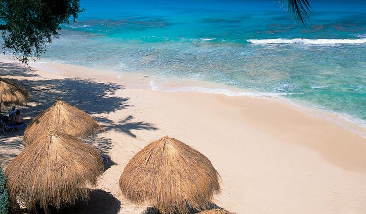 Tamarind Barbados aerial shot of beach cabanas white sand