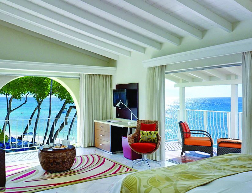 Tamarind Barbados ocean view junior suite bed and lounge area with balcony and terrace overlooking the ocean