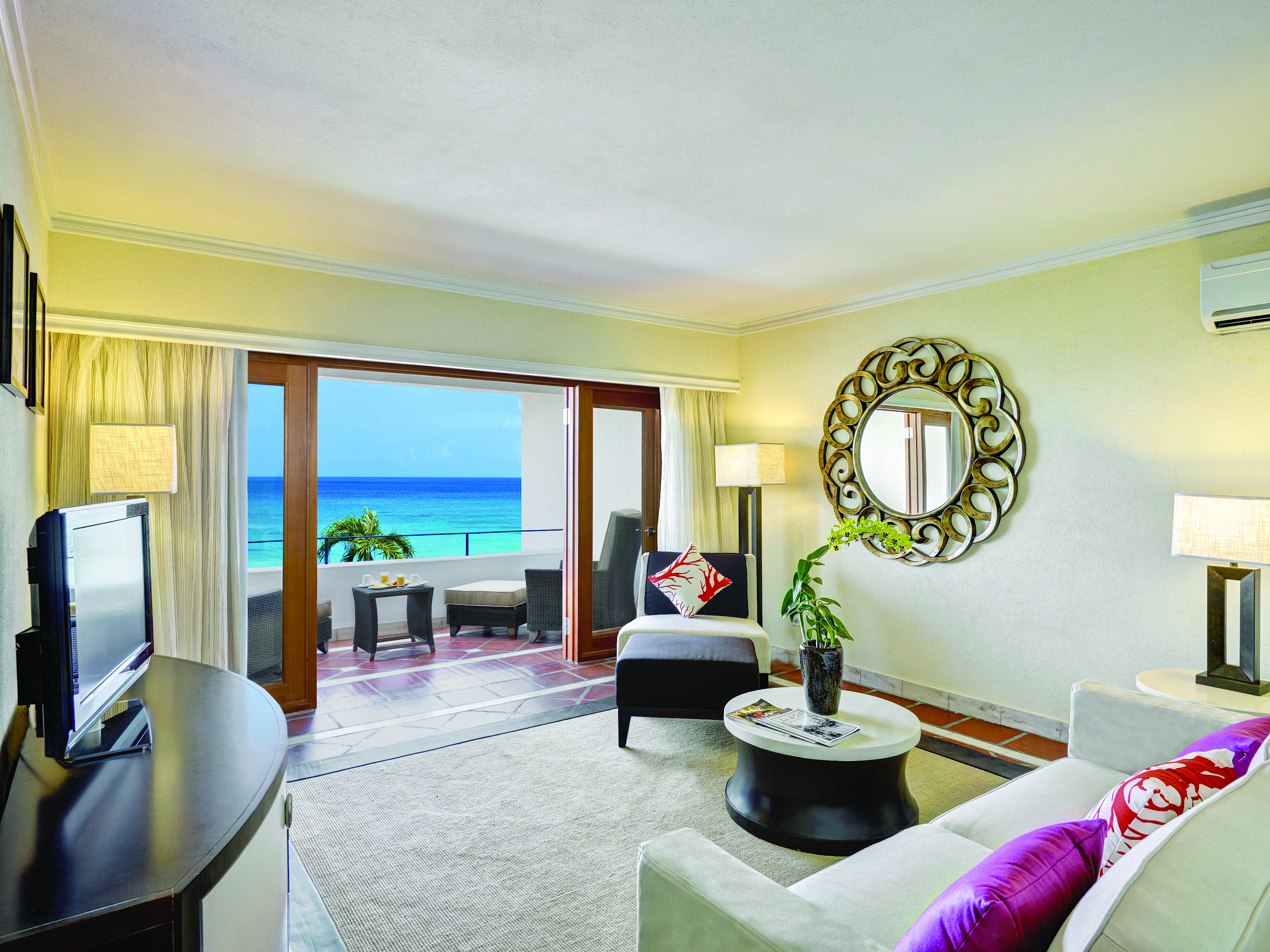 The House Barbados ocean view suite lounge area opening out to terrace overlooking ocean