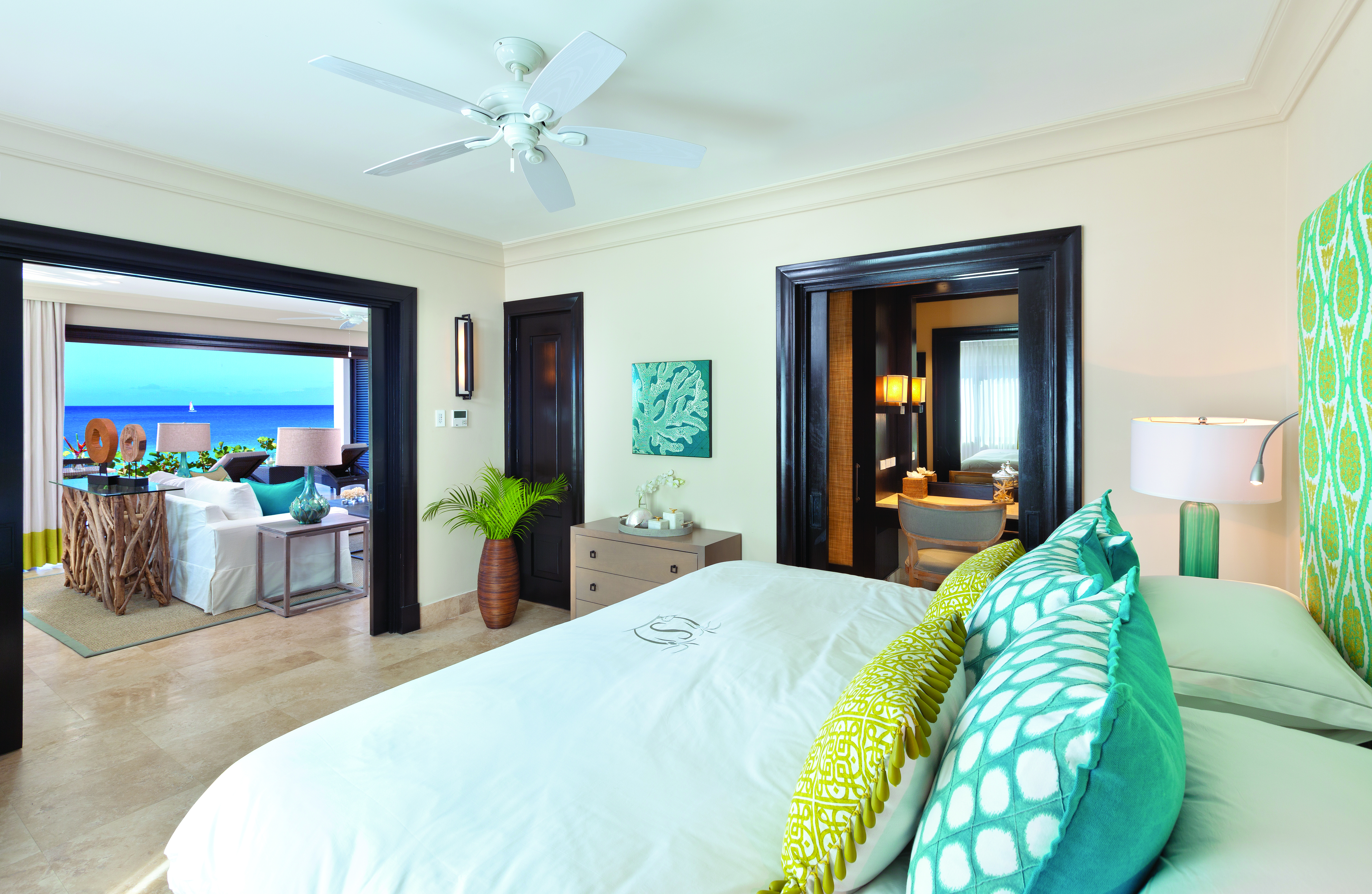 Sandpiper Barbados  beach suite bedroom with adjoining lounge area views of the ocean