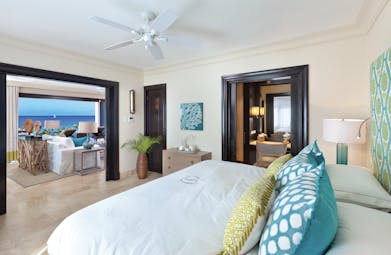 Sandpiper Barbados  beach suite bedroom with adjoining lounge area views of the ocean