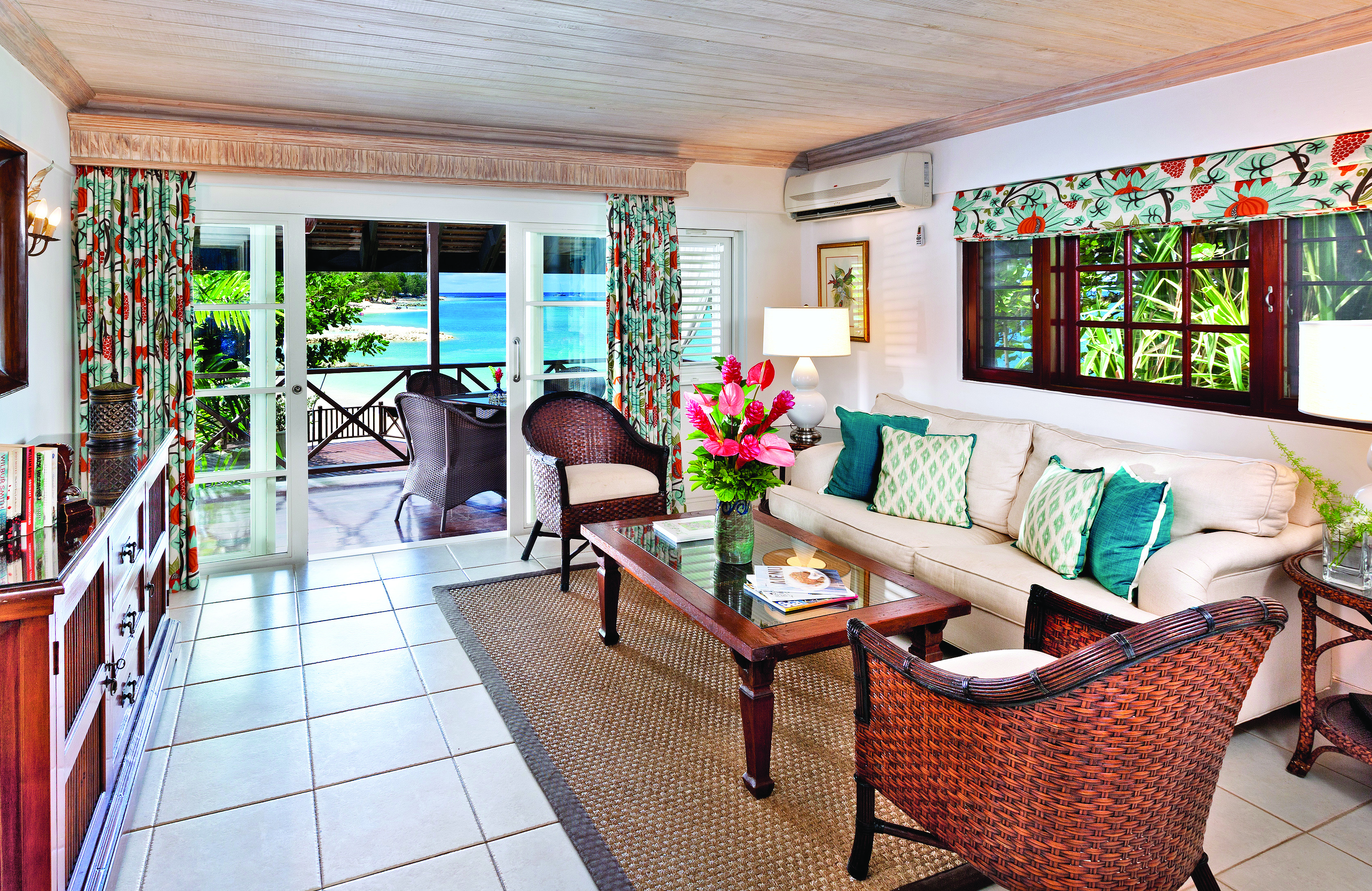 Sandpiper Barbados one bedroom suite lounge leading to terrace seating area with beach views