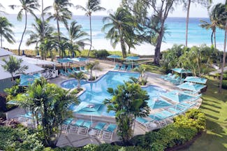 Turtle Beach Barbados pool palm trees overlooking the ocean