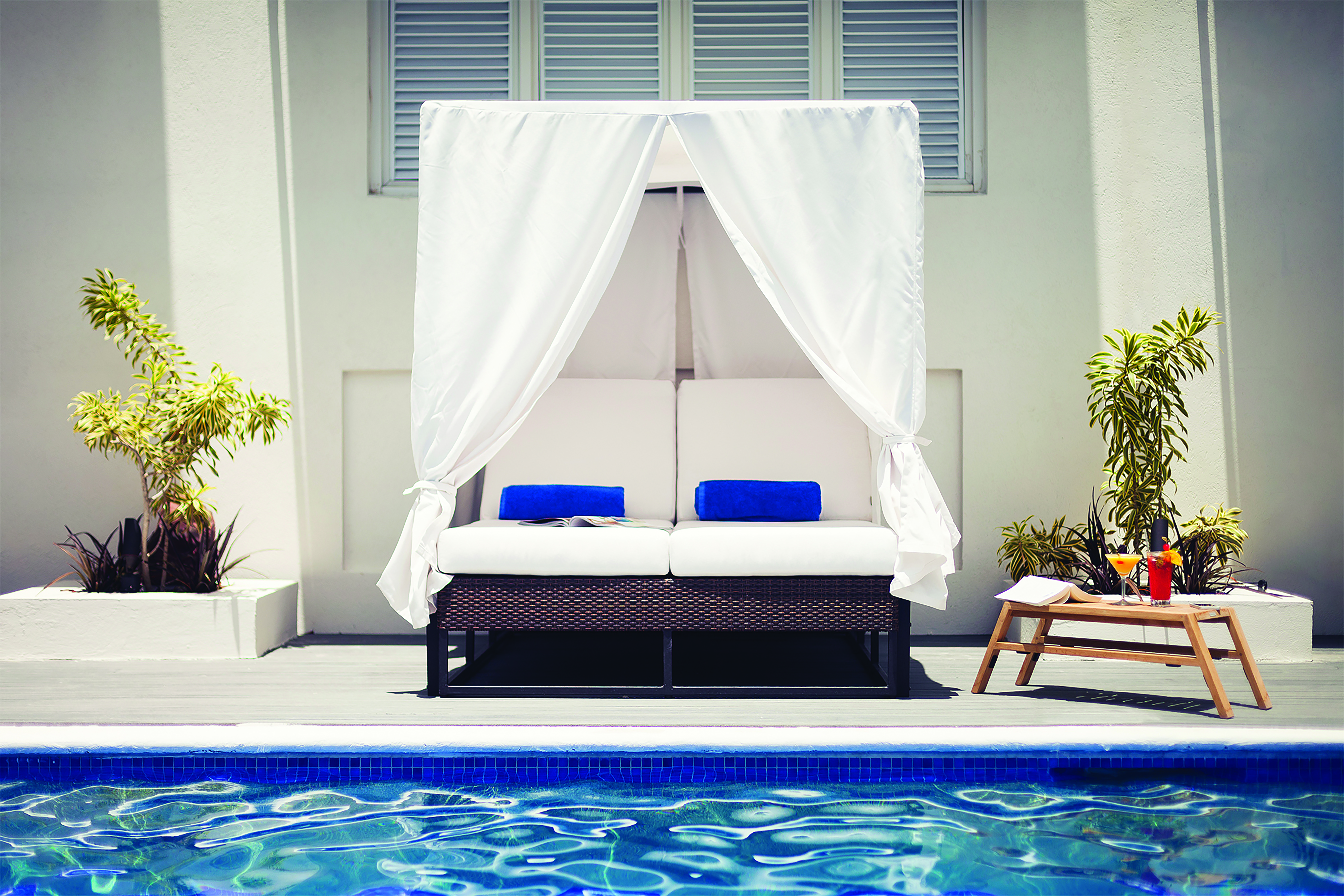 Waves Barbados pool area with canopied sun lounger